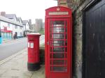 A working telephone booth and Royal Mail Box outside Conwy Castle